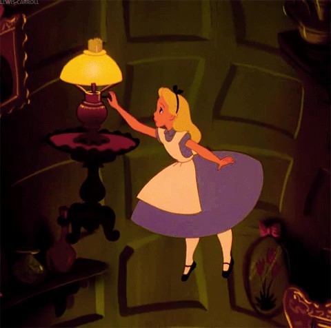 Image of Alice turning on lights as she falls down a hole